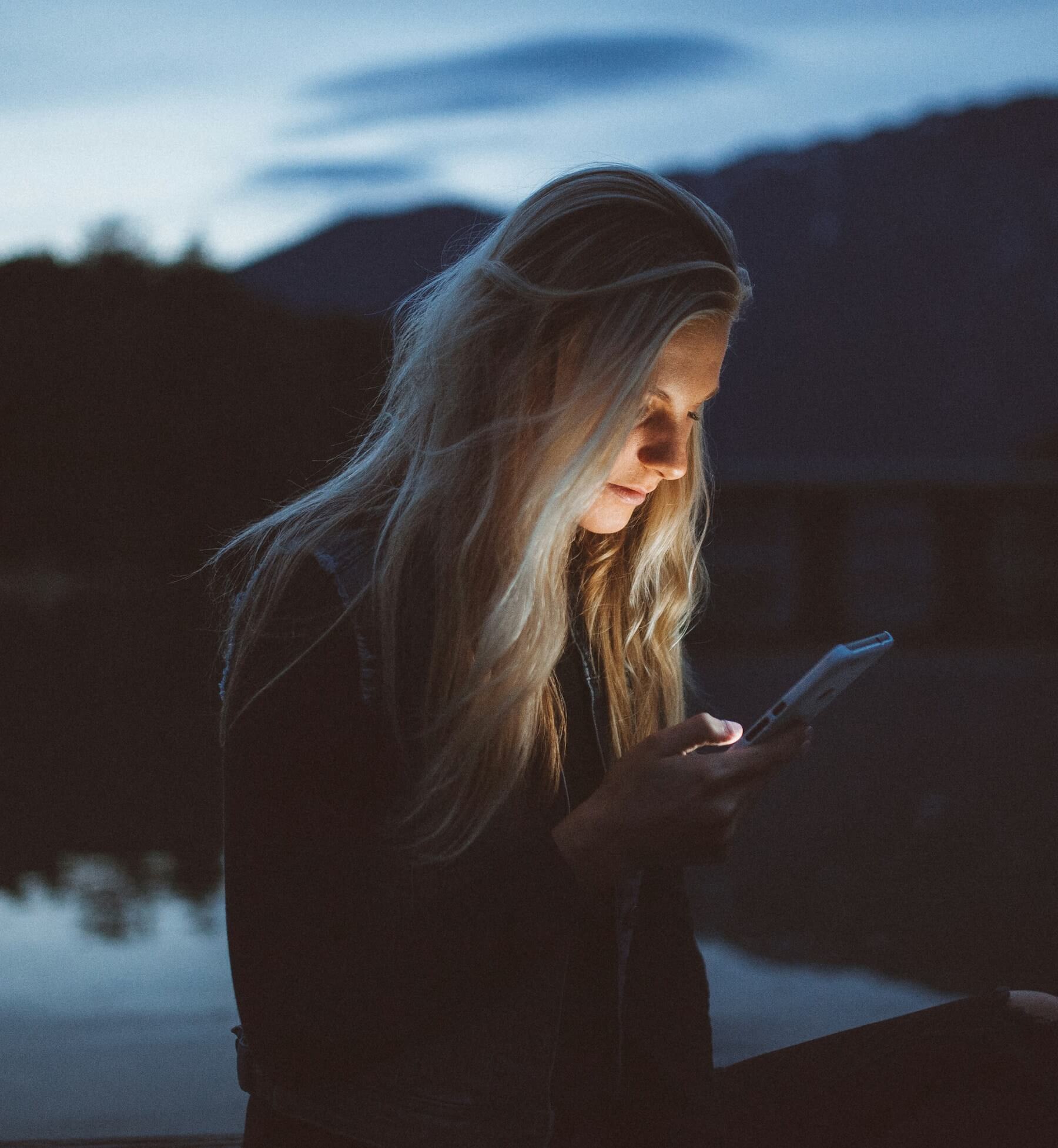 A woman reading something on her phone